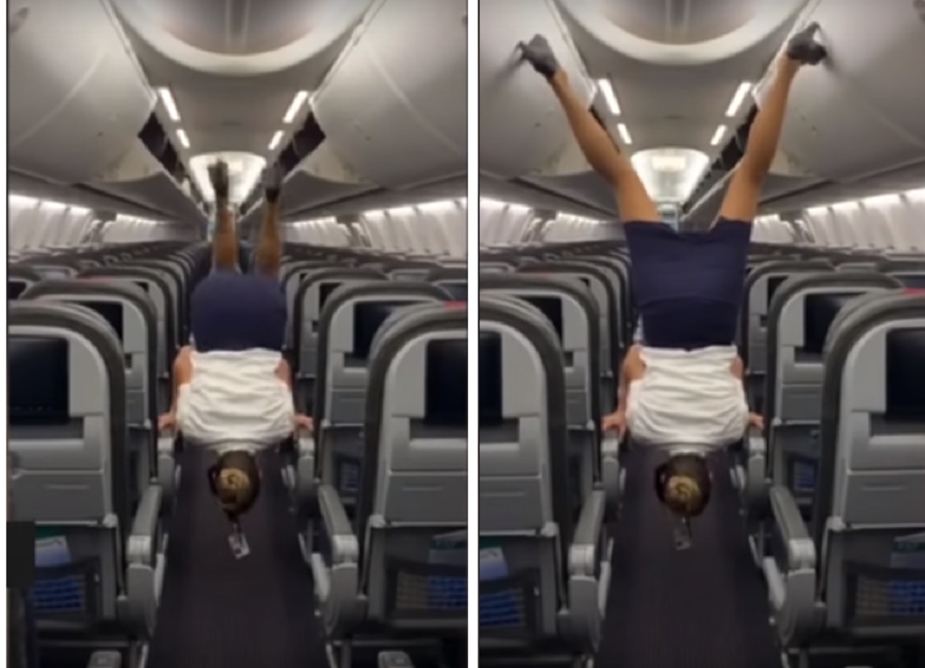 La asistente de vuelo se para de cabeza en un avión mostrando sus notables habilidades acrobáticas 